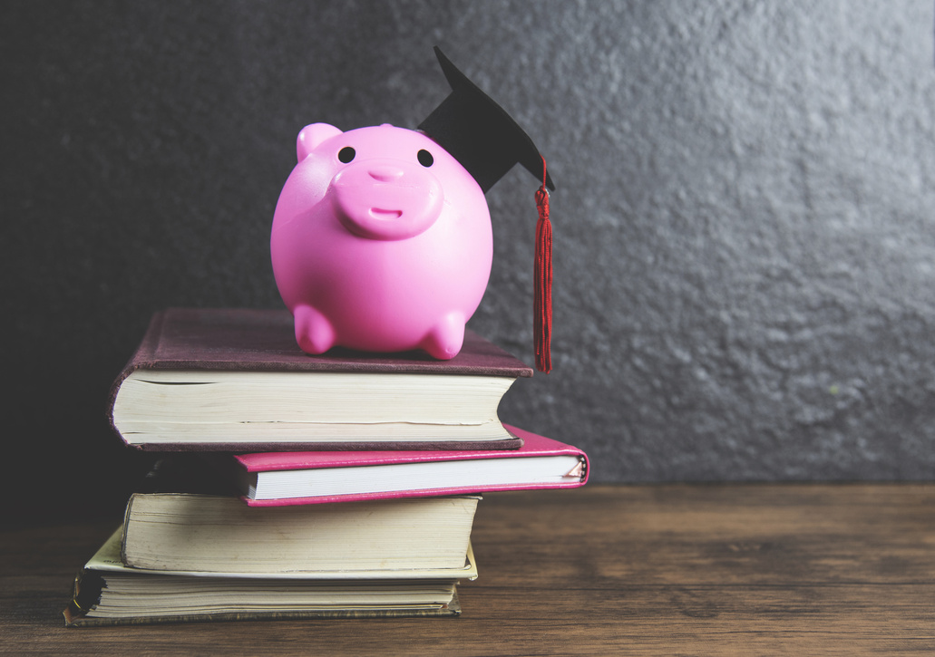 Graduation Cap on Pink Piggy Bank Saving